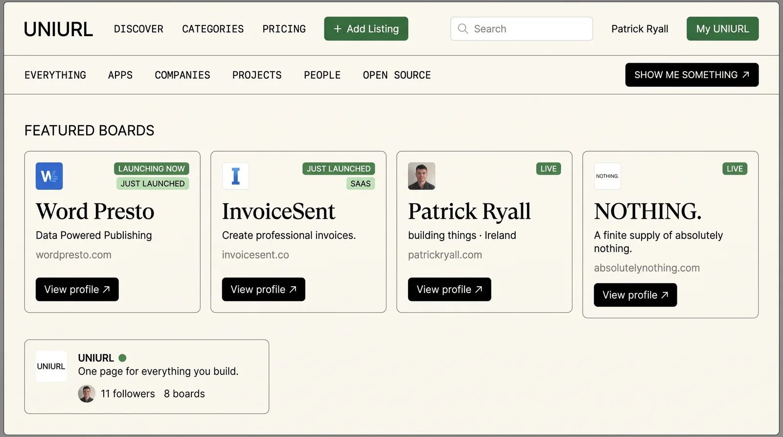 The featured boards row: four boards with status badges, taglines and domains, beside a profile card showing followers and board count